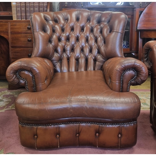 1032 - A good pair of leather effect deep buttoned wing back Armchairs. W 90 cm approx.