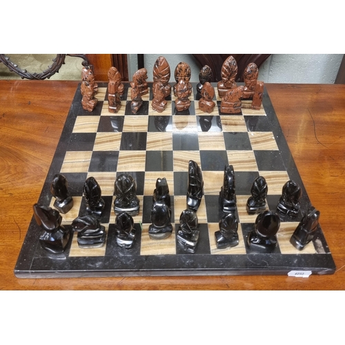 1036 - A Stone Chess Set and board.
35 x  35 cm approx.