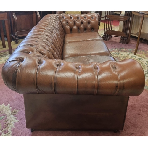 1037 - A good brown leather effect deep buttoned Chesterfield Settee. SH 43 x W 190 x D 90 cm approx.