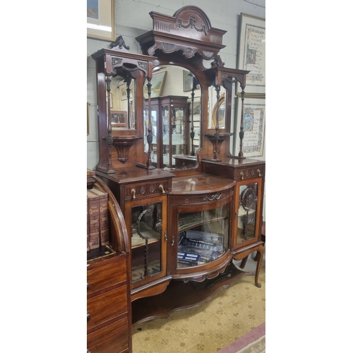 797 - An Edwardian Mahogany Display Cabinet with mirrored back and glazed curved front. W 135 x H 220 cm a... 