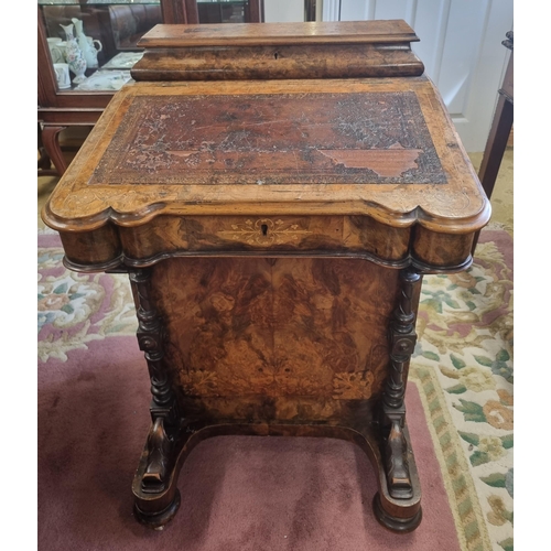 820 - A good 19th Century Walnut Davenport with graduated drawer side and turned front supports on bun fee... 