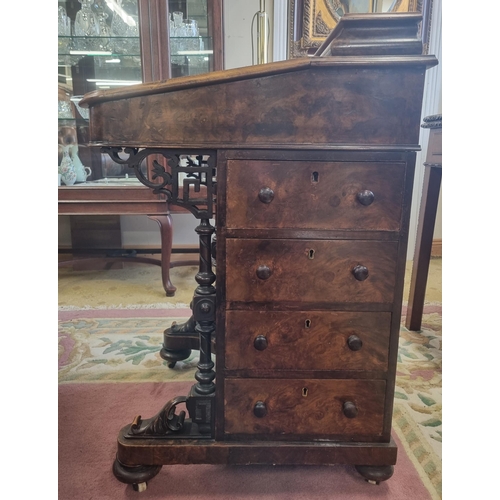 820 - A good 19th Century Walnut Davenport with graduated drawer side and turned front supports on bun fee... 