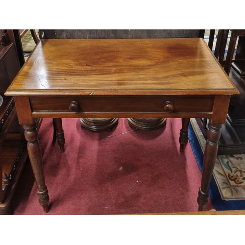 561 - A 19th Century Mahogany Side Table with single frieze drawer on turned supports. 87 x 47 x H 77 cm a... 