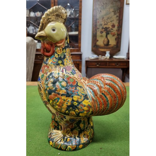 562 - An unusual hand painted Pottery Figure of a Cockerel. H 39 cm approx.