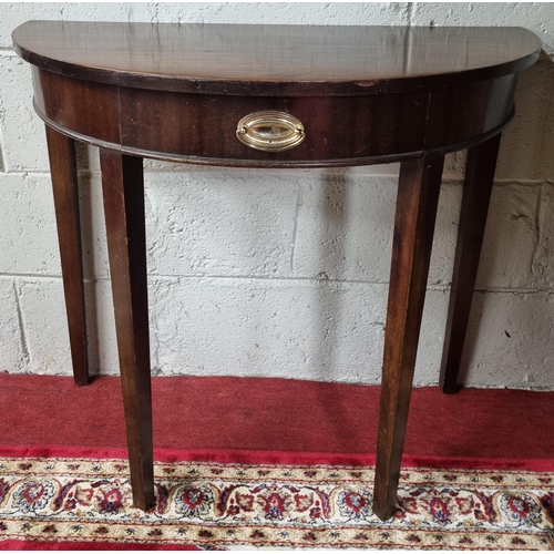 216 - An early 20th Century Mahogany half moon Table of neat proportions on square tapered supports.
84 x ... 