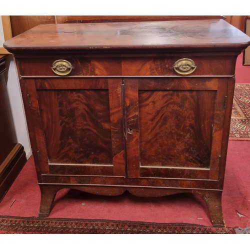 455 - An early 19th Century Mahogany two door Cabinet with single frieze drawer and flame grain panel door... 