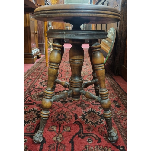 461 - A late 19th early 20th Century Walnut revolving Stool possibly American. D 34 x H 49 cm approx.