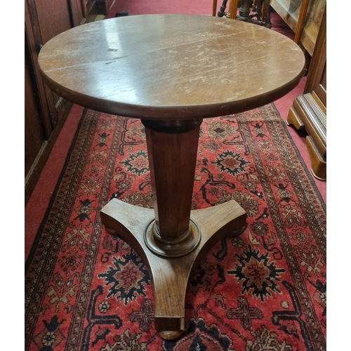 481A - A 19th Century Mahogany circular Table on platform base with bun feet. D 43 x H 55 cm approx.