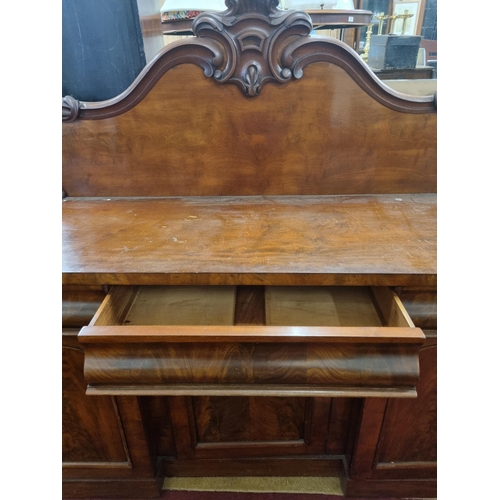 483 - A Victorian Mahogany Pedestal Sideboard with triple frieze drawer and carved gallery back.
 W 152 x ... 