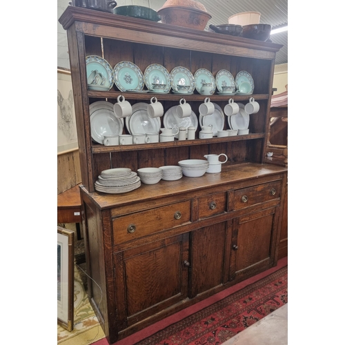 490 - An 18th Century Oak Dresser with triple frieze drawer and twin panel doors. W 157 x H 179 cm approx.