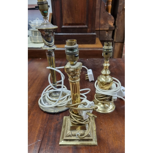 506 - A group of three Brass table Lamps.