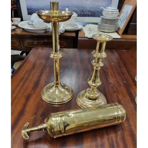 514 - A good quantity of Brass Candlesticks along with a Vintage Brass Extinguisher.