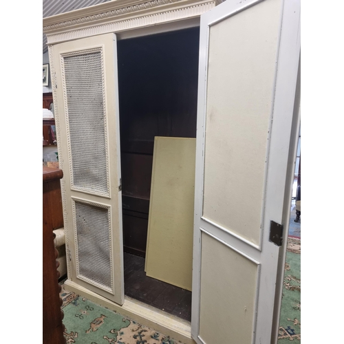 526 - A large 19th Century painted Pine two door Wardrobe with cane work doors.(comes in kit form) W 131 X... 