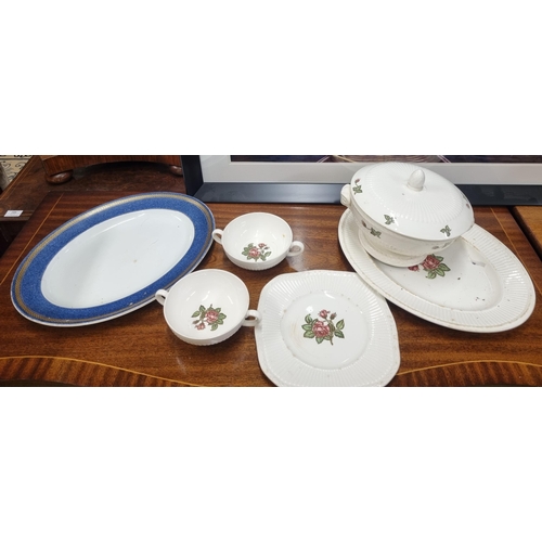 549 - A good quantity of Wedgewood and other Dinner Wares.(on the table and in crates)