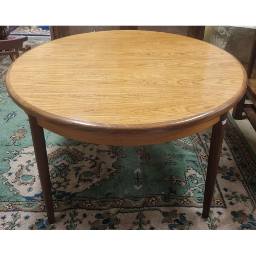 515 - A mid Century single leaf Dining Table possibly G Plan. Closed circular diameter 122 cm, Extended L ... 