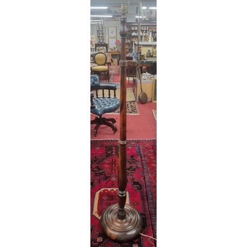 733 - A 20th Century Mahogany Standard Lamp.