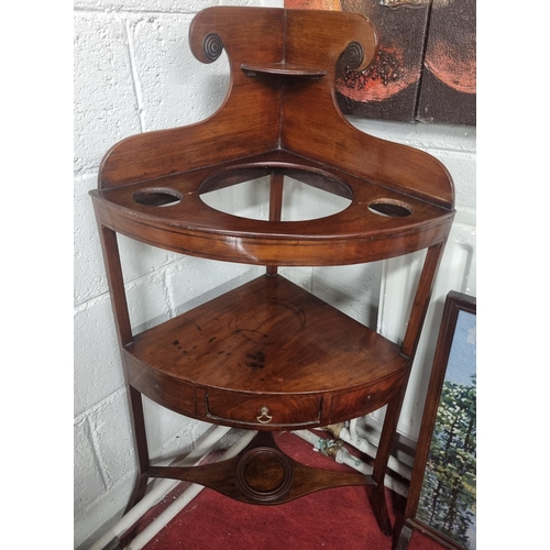 942 - A Georgian Mahogany Corner Washstand along with an urn stand and a fire screen.