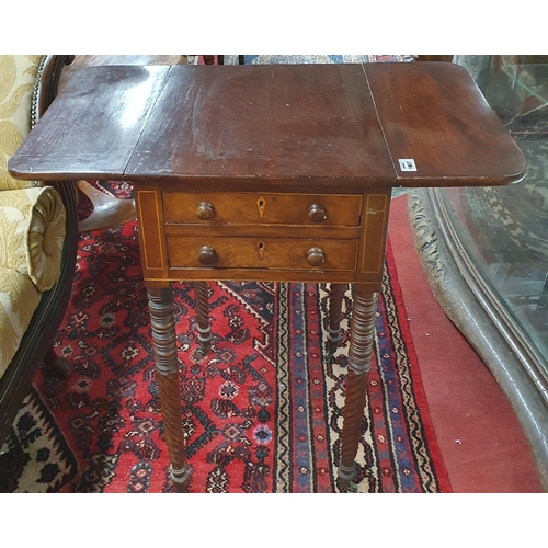 1087 - A Regency Mahogany twin drawer Side Table with drop flap sides on turned supports.
H 75 x W 40/75 x ... 