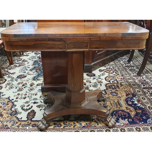 1121 - A Fantastic early 19th Century Irish Rosewood fold over card Table on octagonal support and tripod b... 