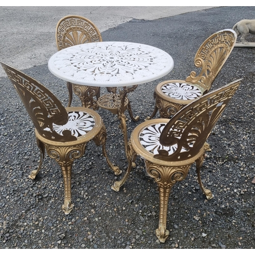 1313 - A good Metal patio Table and four Chairs with pierced outline.