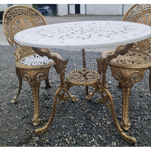 1313 - A good Metal patio Table and four Chairs with pierced outline.