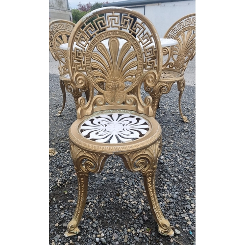 1313 - A good Metal patio Table and four Chairs with pierced outline.