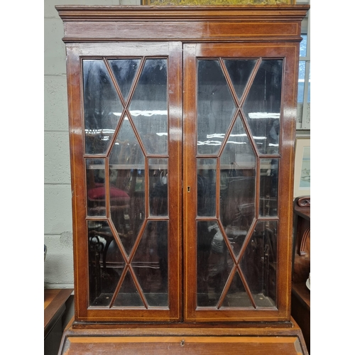 905 - An Edwardian Mahogany and Inlaid Bureau Bookcase with urn inlaid flap. (possibly marriage).
W 79 x H... 