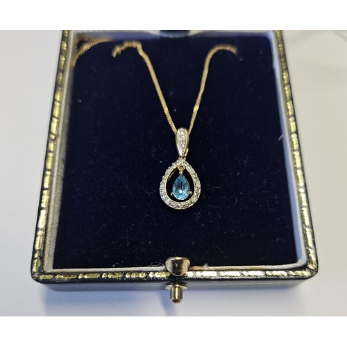 330 - A 9ct Gold, Diamond Pendant set with a Pear cut Topaz.