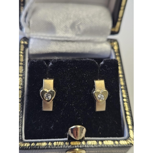 341 - A pair of 9ct Gold and Diamond set Earrings.