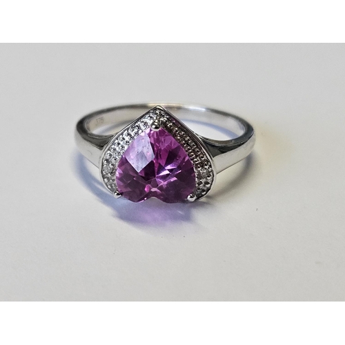 344 - A White Gold, Diamond Ring set with a large heart shaped pink Topaz, size O.