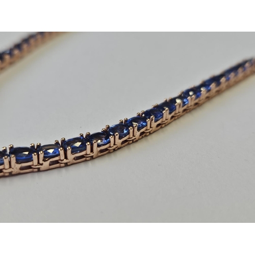 354 - A Silver Gilt Necklace set with Sapphires.