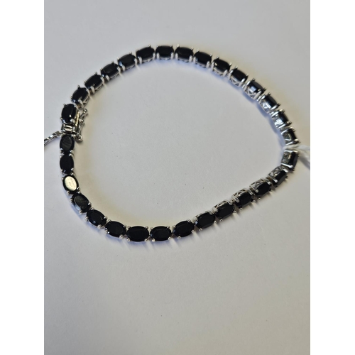 368 - A Silver and Sapphire Bracelet.