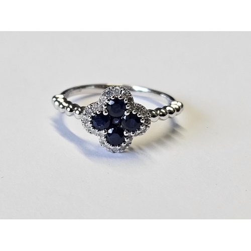 369 - A 9ct Gold Diamond and Sapphire Ring, size M1/2.