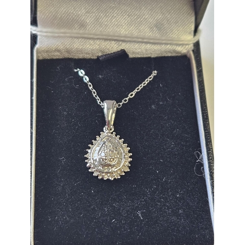 371 - A Silver Diamond set Pendant with Chain.