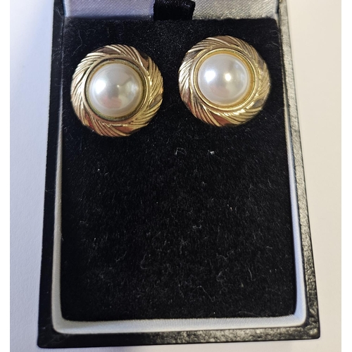 393 - A pair of Gold and Pearl set Earrings of large size