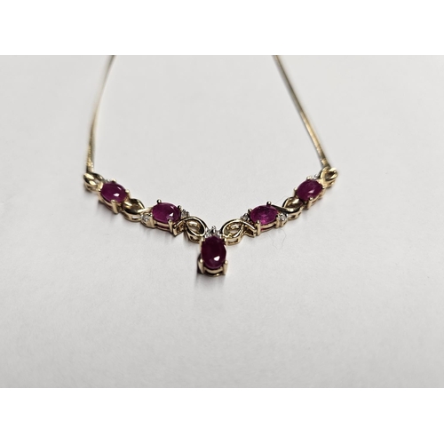 385 - A lovely 9ct Gold, Diamond and Ruby Necklace.