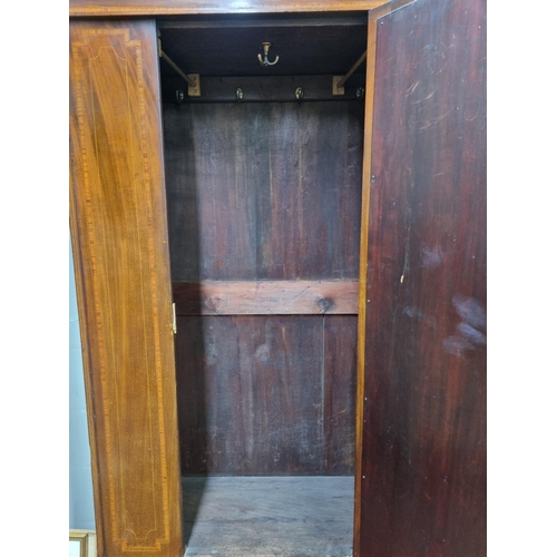 139 - An Edwardian Mahogany and Inlaid single door Wardrobe with oval mirrored centre. 112 x 47 x H 201 cm... 