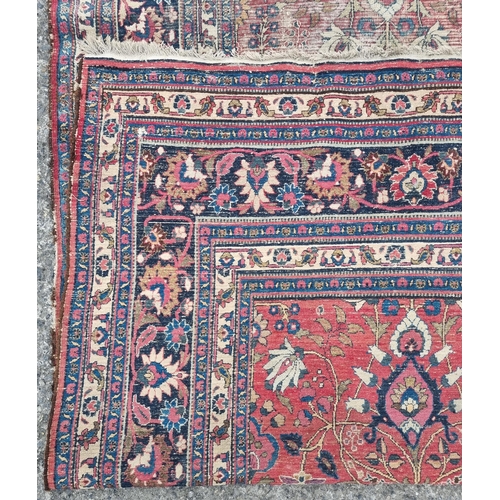 1277 - A large well worn Persian Burgundy ground Carpet with unique medallion design, 410 x 260 cm approx.