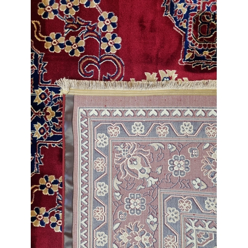 800A - A red ground Turkish Soft Full  Pile Carpet with central medallion design surrounded by borders and ... 