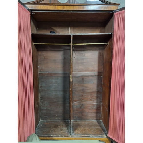 1182 - An extremely large 19th Century Mahogany two door Wardrobe with astragal glazed doors on bracket fee... 