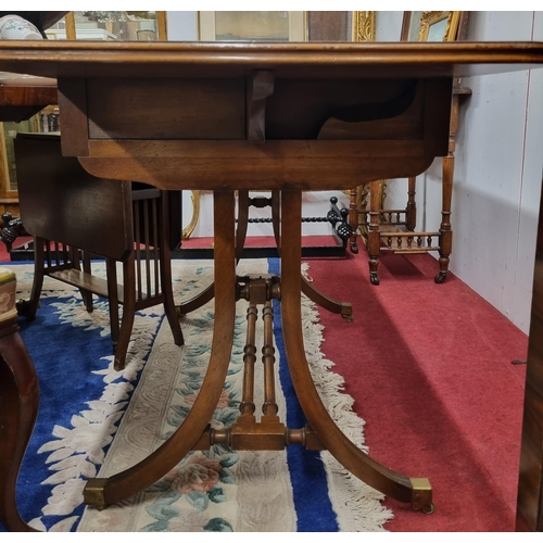 596 - A good early 20th Century Mahogany and Veneered Sofa Table on square supports and stretcher base wit... 