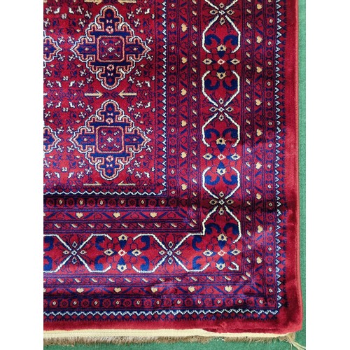 700A - A red ground Turkish Soft Full  Pile Carpet with central medallion design surrounded by borders and ... 