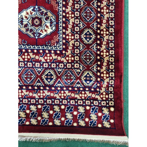 900B - A red ground Turkish Soft Full  Pile Carpet with central medallion design surrounded by borders and ... 