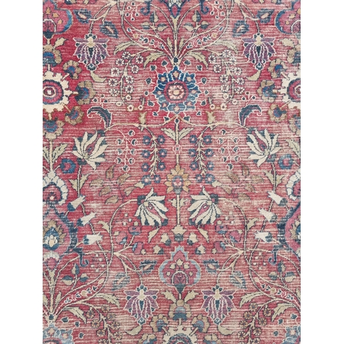 1277 - A large well worn Persian Burgundy ground Carpet with unique medallion design, 410 x 260 cm approx.