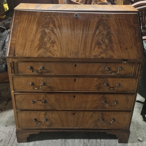 1293 - A 19th Century Mahogany Bureau with flame grain fall flap and a fitted interior.