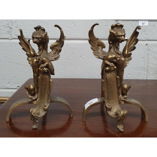 85 - A good pair of 19th Century Fire Dogs depicting gargoyles. H 22 cm approx.