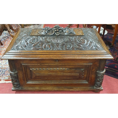 A Superb early to mid 19th Century Irish Oak Cellerette with highly carved sarcophagus shaped outline. The top depicting an urn holding a bunch of fruit. 89 x 55 x H 56 cm approx.