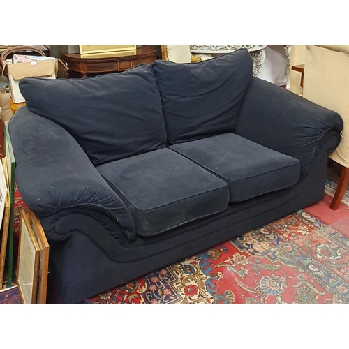 895 - Two, two seater black upholstered Couches. W 183 cm approx.