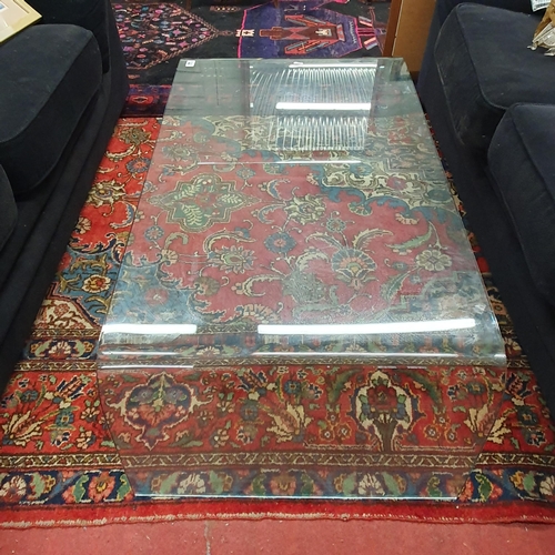 898 - A designer Glass Coffee Table. 110 x 60 x H 39 cm approx.