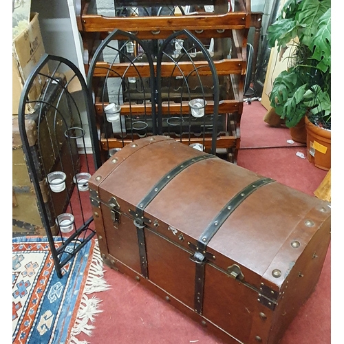 909 - A Pine Wine Rack along with a leather covered trunk, a three division candle holder and a retro figu... 